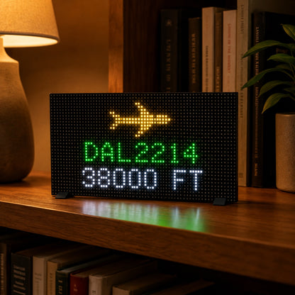 Open-source pixel display kit showing flights overhead app — DAL2214 at 38,000 ft